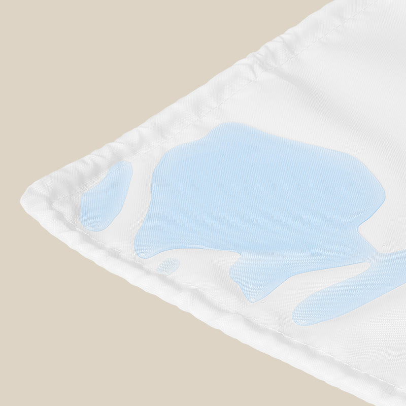 A white water-repellent crib base protector to put under the mattress and protect the floor or bed base.