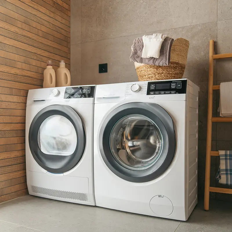 matching washing machine and dryer next to each other