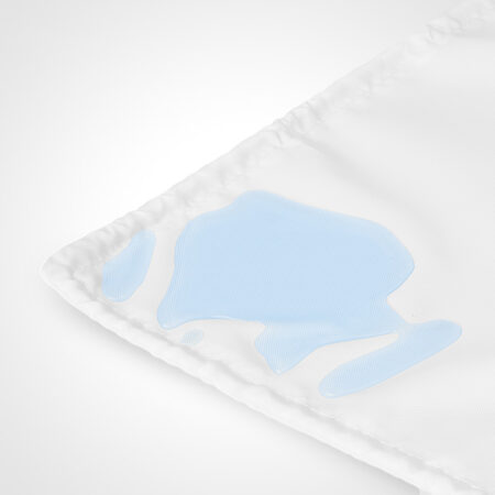 corner of crib base protector with water on it on white background